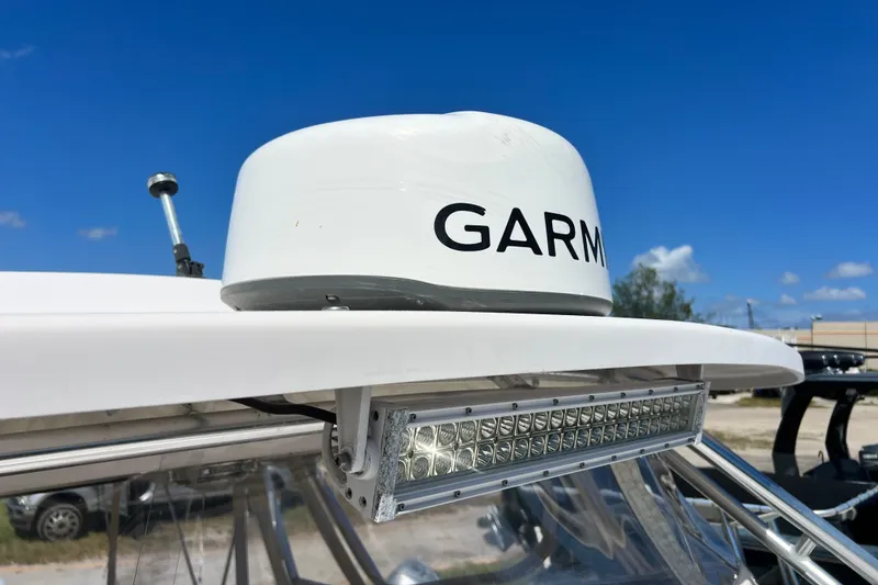 Slide: The Image of Garmin radar on 2006 Grady-White Express 330 boat under clear blue sky. - 48