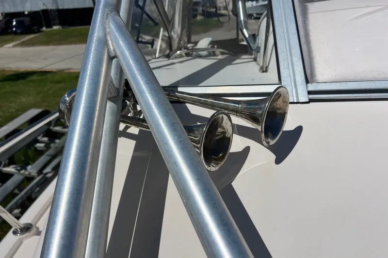 Slide: The Image of Close-up of a 2006 Grady-White Express 330 boat's metal railings and horns. - 49