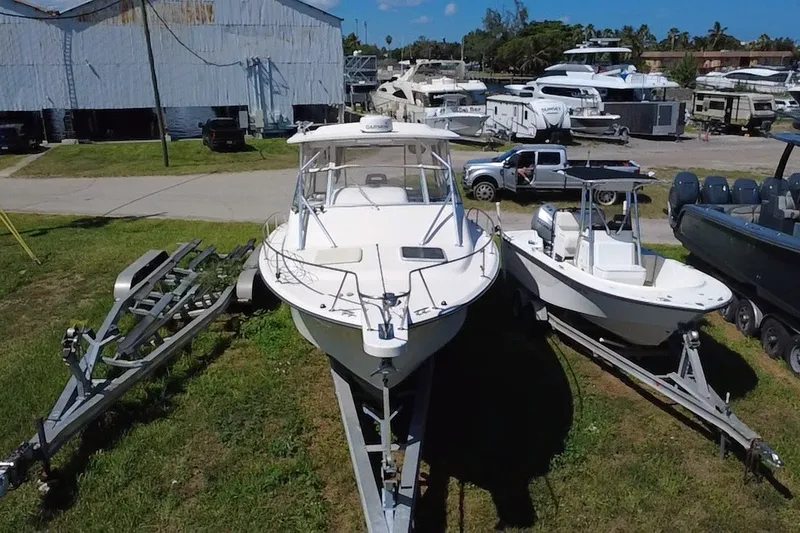Slide: The Image of 2006 Grady-White Express 330 boat on trailer in marina storage area. - 5