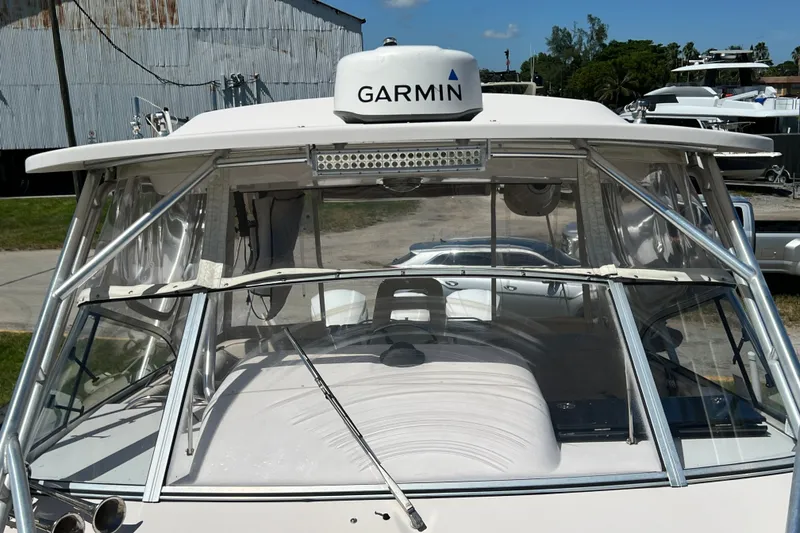 Slide: The Image of 2006 Grady-White Express 330 boat with Garmin radar, docked outdoors. - 43