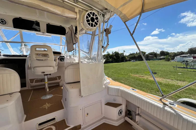 Slide: The Image of Interior view of 2006 Grady-White Express 330 boat with seating and clear skies. - 22