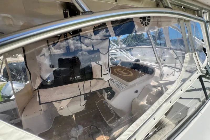 Slide: The Image of 2006 Grady-White Express 330 boat interior with clear enclosure and control panel. - 50