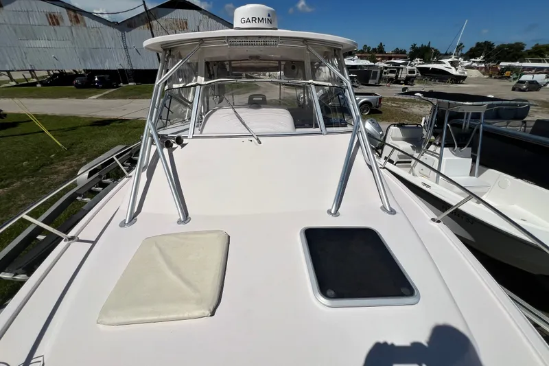 Slide: The Image of 2006 Grady-White Express 330 boat deck with Garmin equipment, docked outdoors. - 42