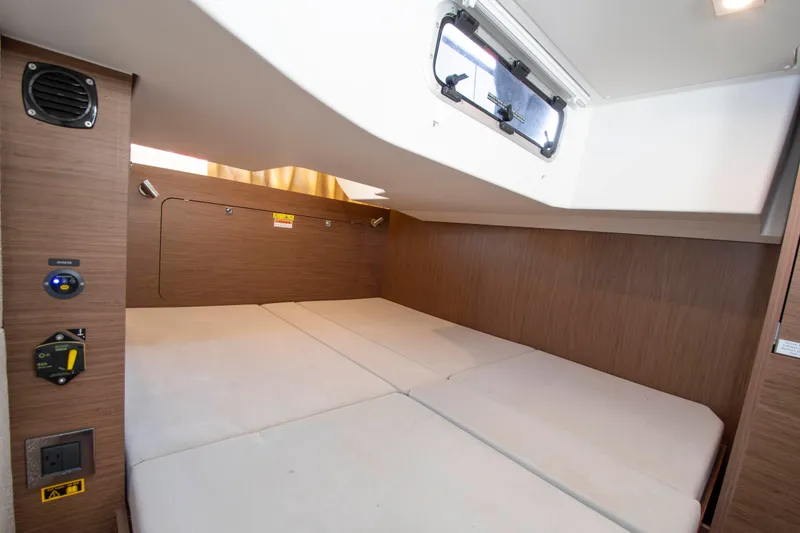 Slide: The Image of Interior of the 2018 Jeanneau Leader 33 featuring a cozy sleeping area. - 7