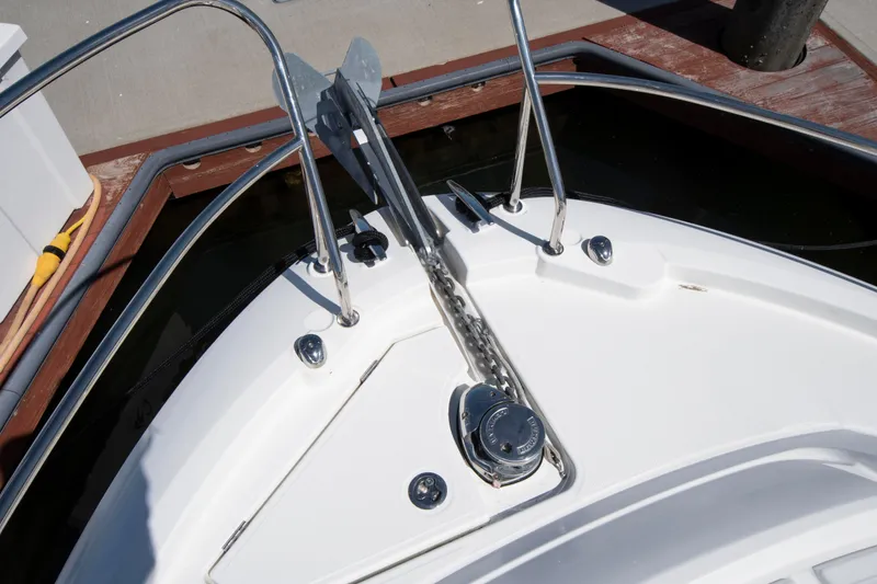 Slide: The Image of The bow of a 2018 Jeanneau Leader 33 with anchor windlass and stainless steel railing. - 13