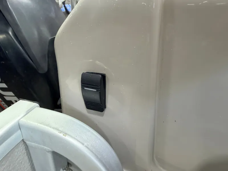 Slide: The Image of Close-up of a switch on a boat, next to an outboard motor. - 45