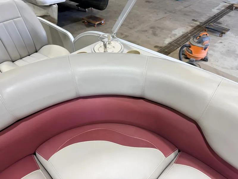 Slide: The Image of The image shows a boat interior with cream and pink upholstery. - 24