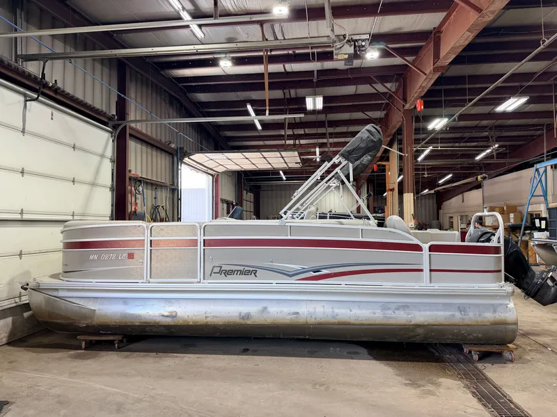 Slide: The Image of A 2014 Premier 221 Gemini Fish n Cruise pontoon boat is in a warehouse. - 49