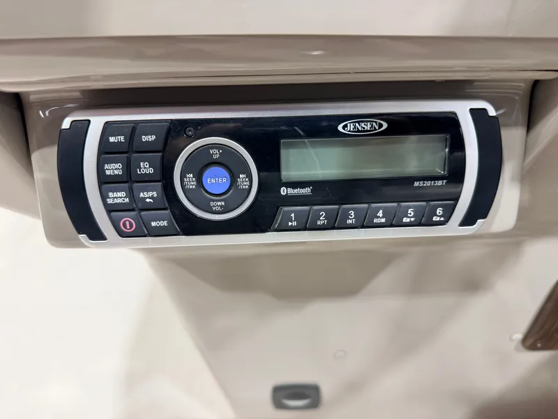 Slide: The Image of A Jensen audio system is installed in a boat, featuring various controls and a display. - 18