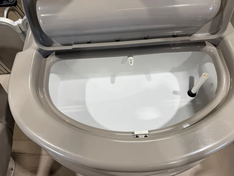 Slide: The Image of An open, oval compartment on a boat, possibly a storage area or cooler. - 41