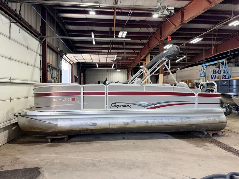 Slide: The Image of A 2014 Premier 221 Gemini Fish n Cruise pontoon boat is in a warehouse. - 20
