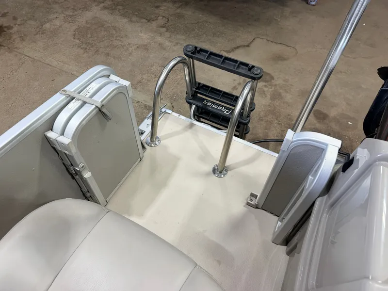 Slide: The Image of The image shows the rear area of a boat with a swim ladder and seating. - 32