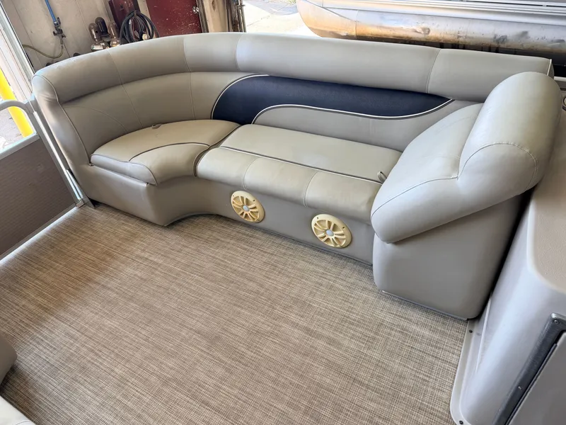 Slide: The Image of The image shows a cushioned seating area in a boat with speakers underneath. - 11