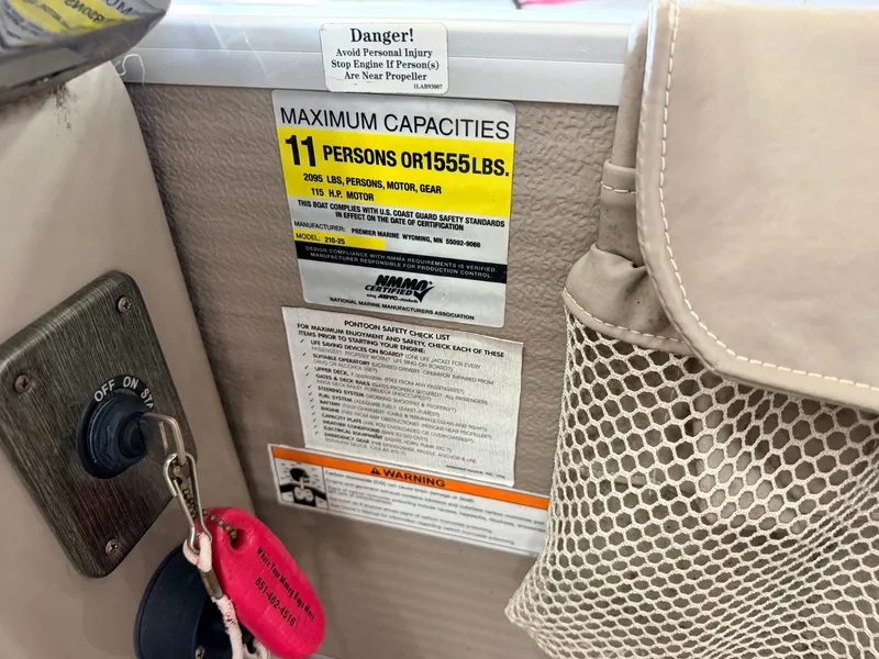Slide: The Image of Warning labels and safety information on a boat, including maximum capacity and safety checklist. - 49