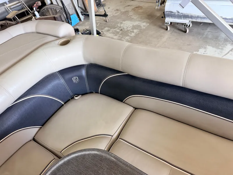 Slide: The Image of The interior of a 2007 Premier 210 Legend with beige and dark blue upholstery. - 30