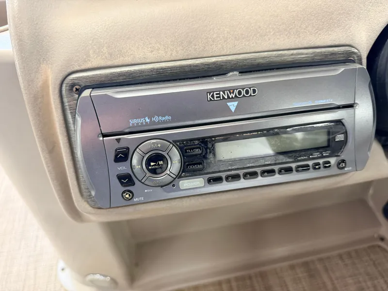 Slide: The Image of A Kenwood car stereo is installed in the dashboard of a 2007 Premier 210 Legend. - 23