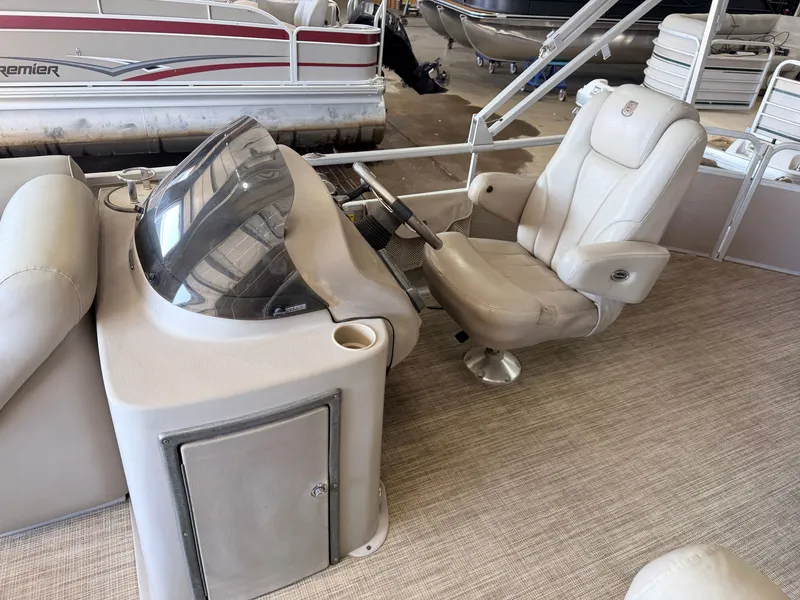 Slide: The Image of The image shows the cockpit of a 2007 Premier 210 Legend with a comfortable captain's chair. - 16