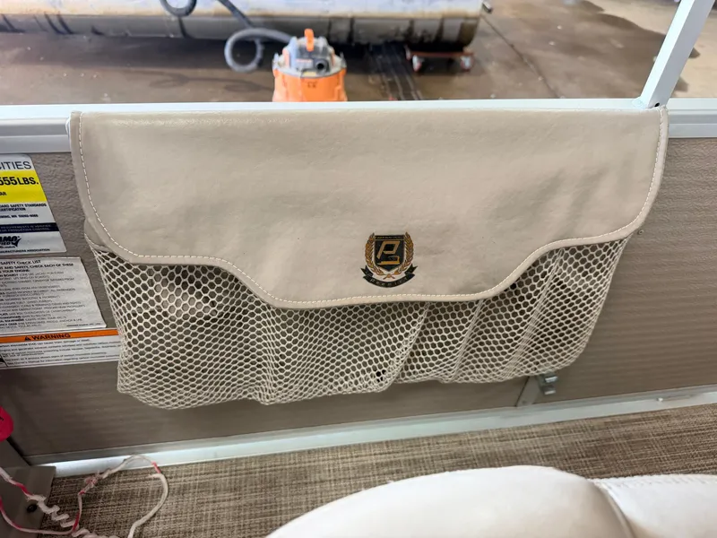 Slide: The Image of Mesh pocket with Premier logo on the boat wall. - 25