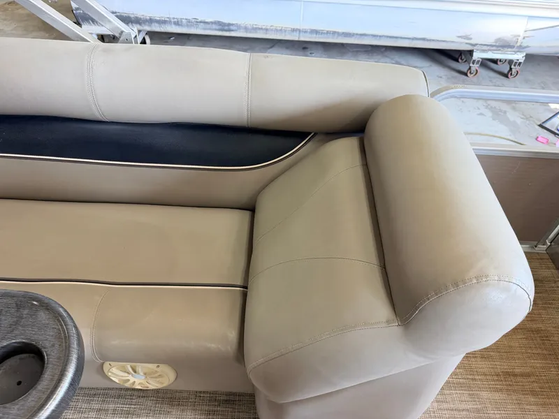 Slide: The Image of The image shows a beige bench seat with a black accent stripe and a built-in speaker. - 28