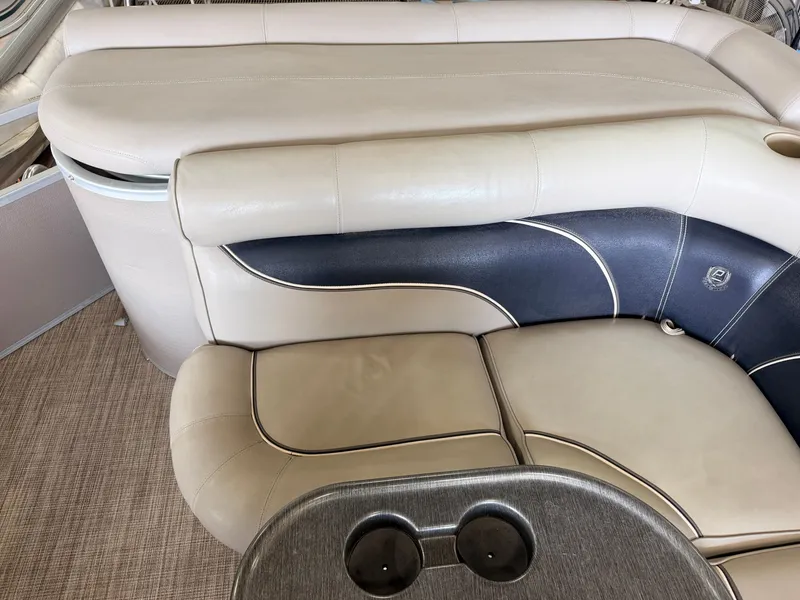 Slide: The Image of The image shows the beige and dark blue upholstery of a 2007 Premier 210 Legend. - 31
