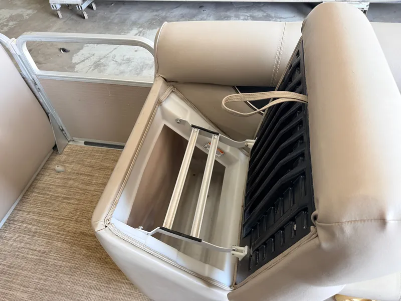 Slide: The Image of A boat seat with an open storage compartment underneath. - 14