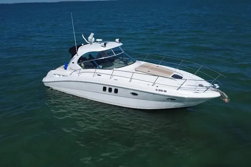 Slide: The Image of 2008 Sea Ray 380 Sundancer yacht cruising on open water. - 1