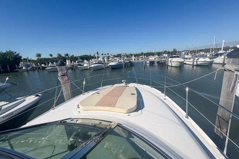 Slide: The Image of 2008 Sea Ray 380 Sundancer docked in a sunny marina with clear blue skies. - 19
