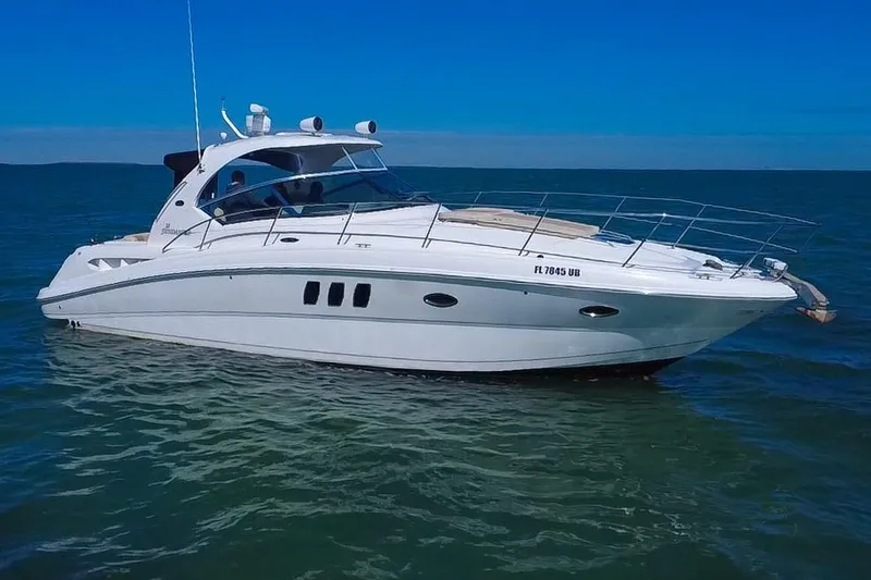Slide: The Image of 2008 Sea Ray 380 Sundancer yacht cruising on open water. - 87