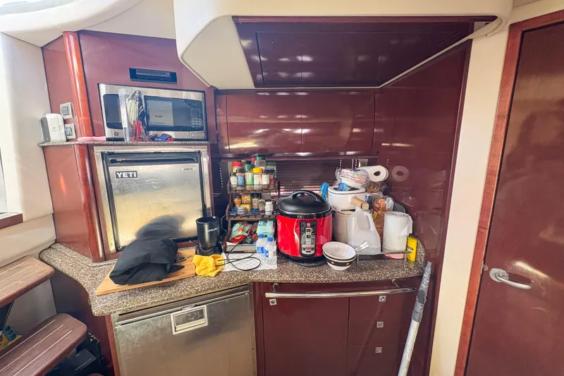 Slide: The Image of Galley of 2008 Sea Ray 380 Sundancer with appliances and storage. - 50