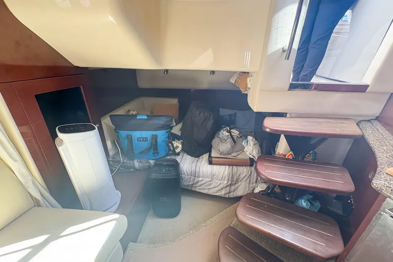 Slide: The Image of Interior of 2008 Sea Ray 380 Sundancer with stairs, seating, and storage items. - 51