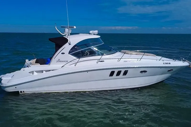 Slide: The Image of 2008 Sea Ray 380 Sundancer yacht cruising on open water under clear skies. - 86