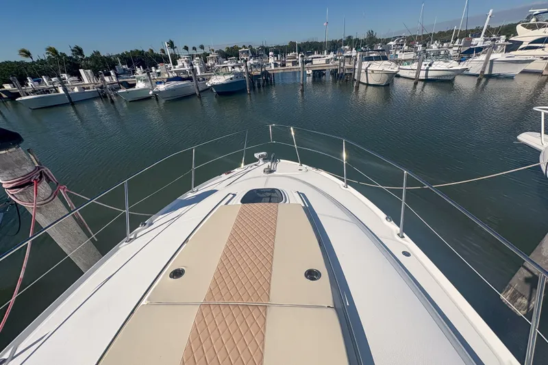 Slide: The Image of Bow view of 2008 Sea Ray 380 Sundancer docked in a marina. - 21