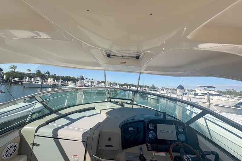 Slide: The Image of 2008 Sea Ray 380 Sundancer yacht cockpit with Garmin navigation, docked at marina. - 9