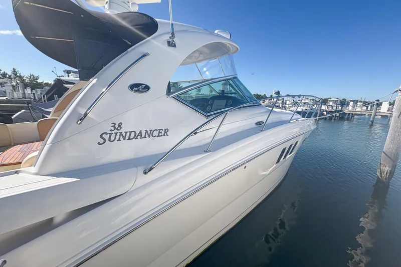 Slide: The Image of 2008 Sea Ray 380 Sundancer yacht docked at marina under clear blue sky. - 17