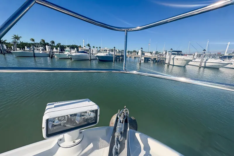 Slide: The Image of Bow view from 2008 Sea Ray 380 Sundancer in marina, clear blue sky. - 29