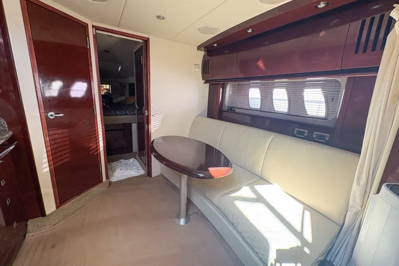 Slide: The Image of Luxurious interior of 2008 Sea Ray 380 Sundancer yacht with elegant seating and table. - 71