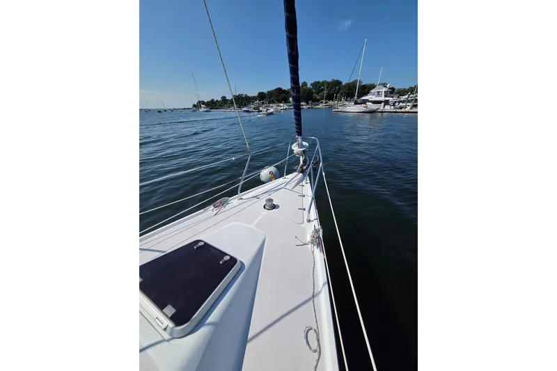 Slide: The Image of Sailboat deck view of 2002 Catalina 390 in a marina setting. - 21
