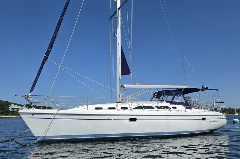 The Image of 2002 Catalina 390 sailboat on calm water under clear blue sky. - 0