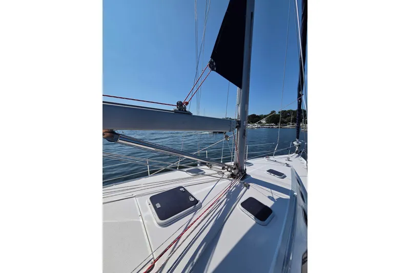 Slide: The Image of Sailing on a 2002 Catalina 390 yacht, clear blue sky and calm waters. - 20