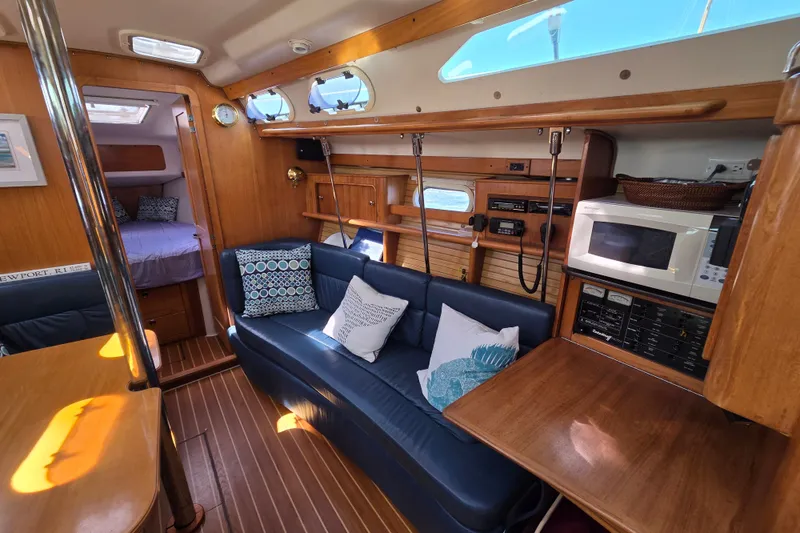 Slide: The Image of Interior of 2002 Catalina 390 yacht with cozy seating and modern amenities. - 31