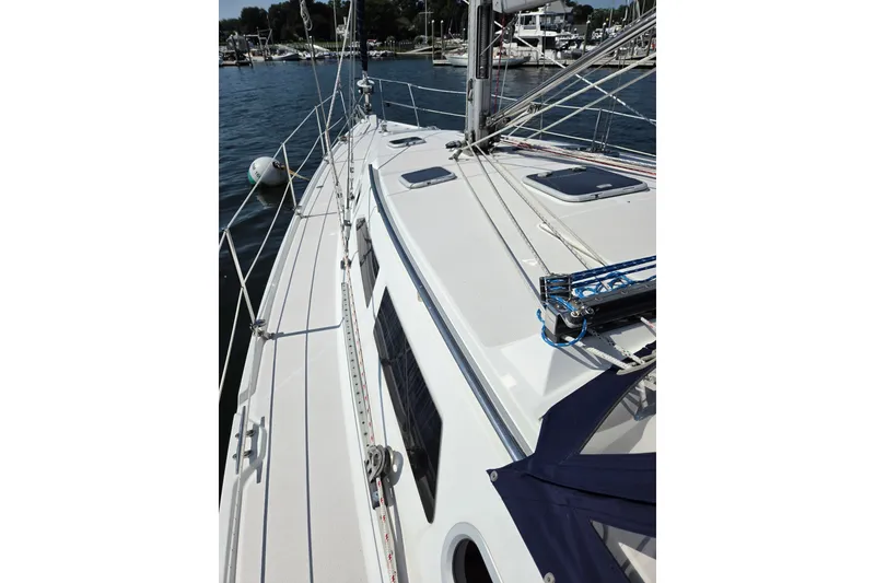 Slide: The Image of Sailboat deck view of 2002 Catalina 390, docked in a marina. - 24