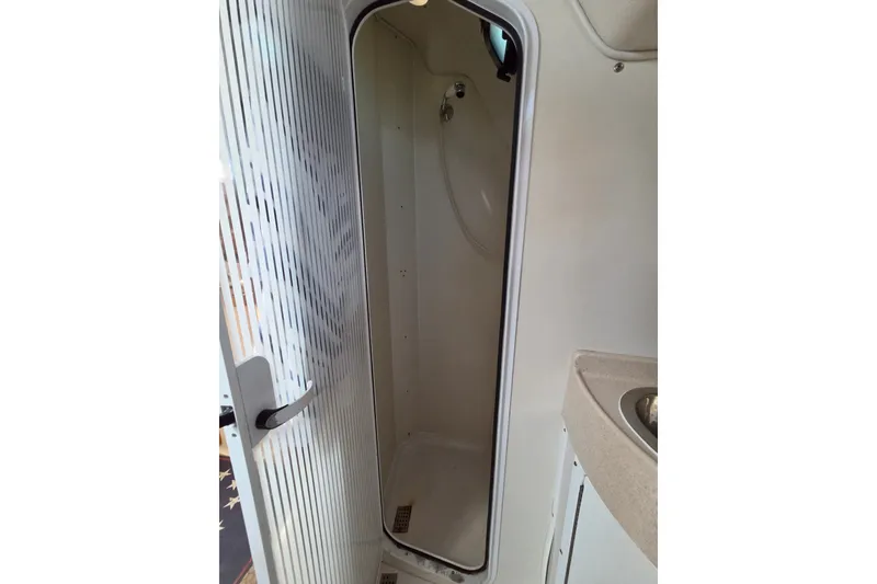 Slide: The Image of Compact shower area in a 2002 Catalina 390 boat interior. - 39