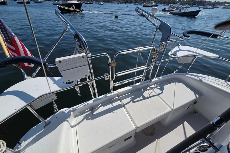 Slide: The Image of Rear deck of a 2002 Catalina 390 sailboat with water view and American flag. - 17