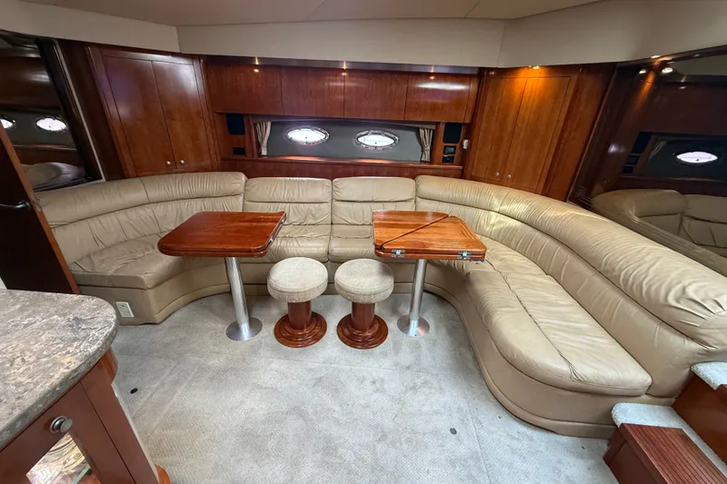 Slide: The Image of Luxurious 2008 Cruisers Yachts 520 Express interior with leather seating and wooden accents. - 22
