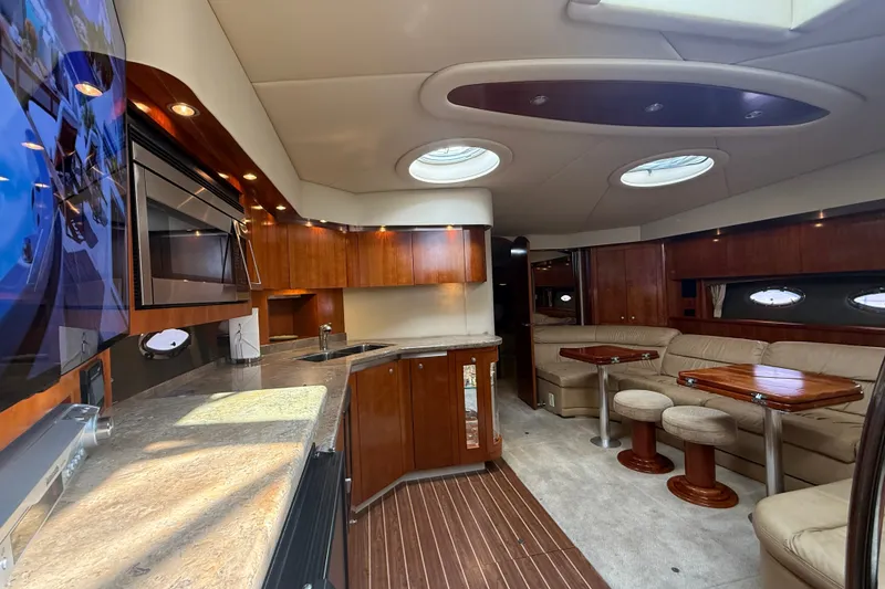 Slide: The Image of Luxurious interior of 2008 Cruisers Yachts 520 Express with elegant wood finishes and plush seating. - 14