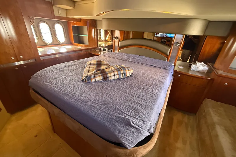 Slide: The Image of Luxurious bedroom interior of 2008 Cruisers Yachts 520 Express with elegant wood finishes. - 16