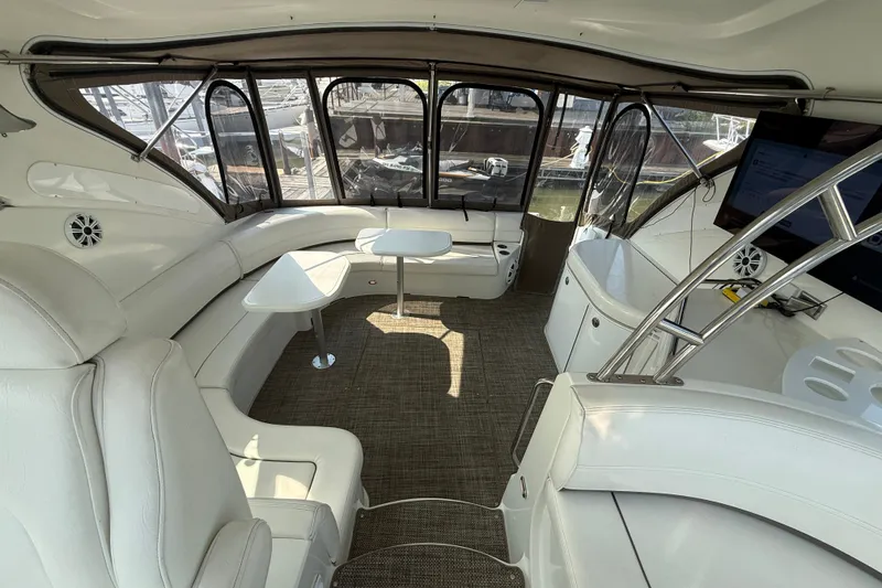 Slide: The Image of Luxurious interior of 2008 Cruisers Yachts 520 Express with white seating and modern amenities. - 27