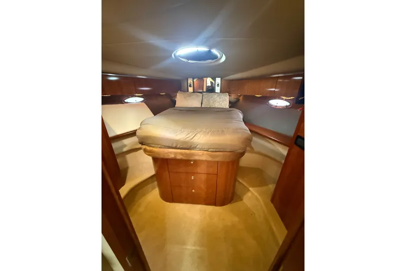 Slide: The Image of Luxurious cabin interior of 2008 Cruisers Yachts 520 Express with cozy bed and wooden finish. - 21
