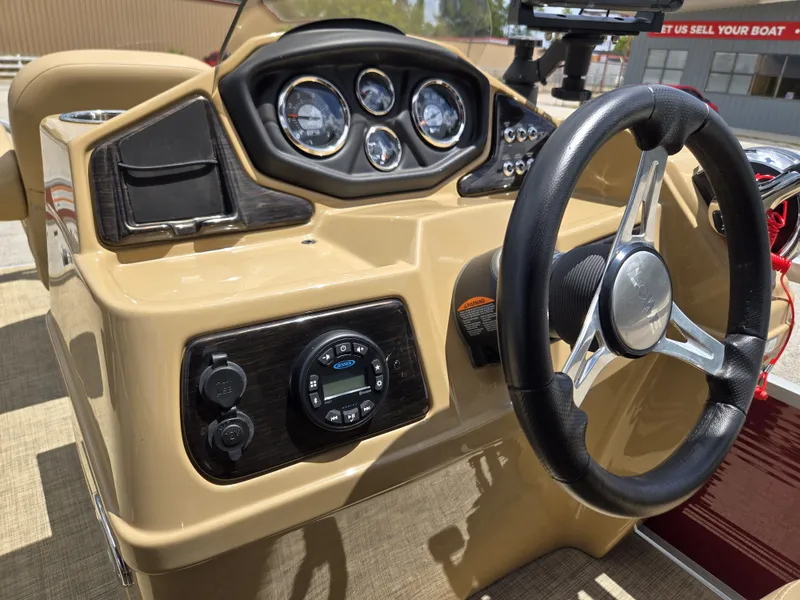 Slide: The Image of The image shows the helm of a 2020 Lowe SF 232 boat with multiple gauges. - 19