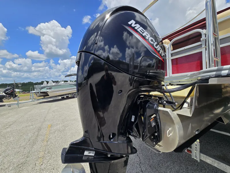 Slide: The Image of A Mercury outboard motor is attached to a 2020 Lowe SF 232 boat, parked on a lot. - 30